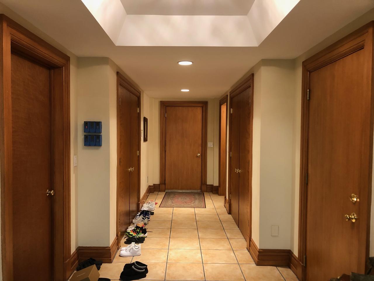 Hallway with plain wood doors before
