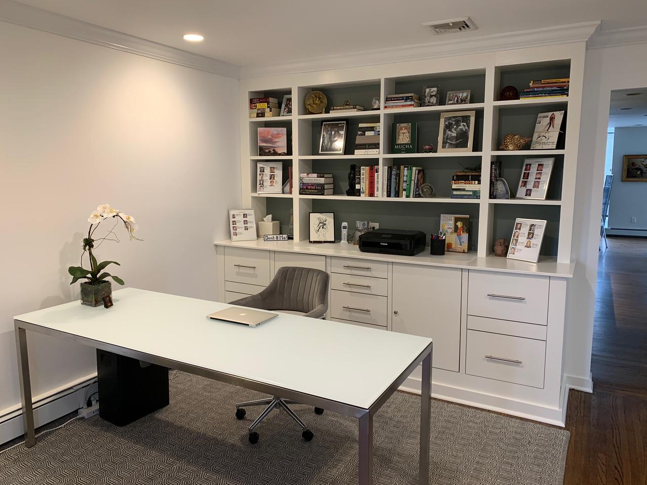 Built-in office cabinetry and shelving with desk