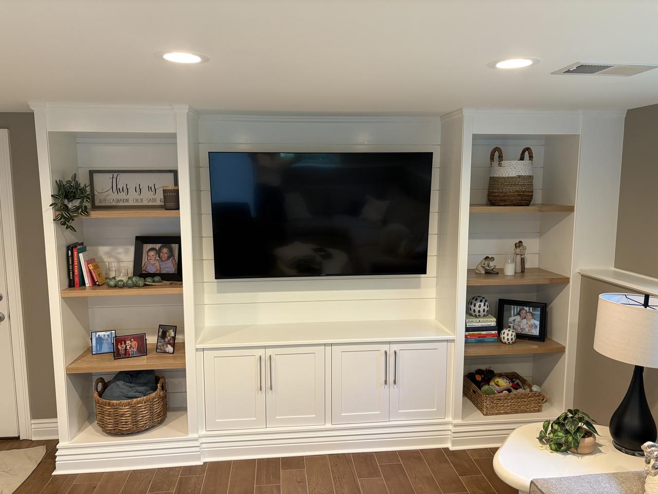 Cream built-in entertainment center with shelving