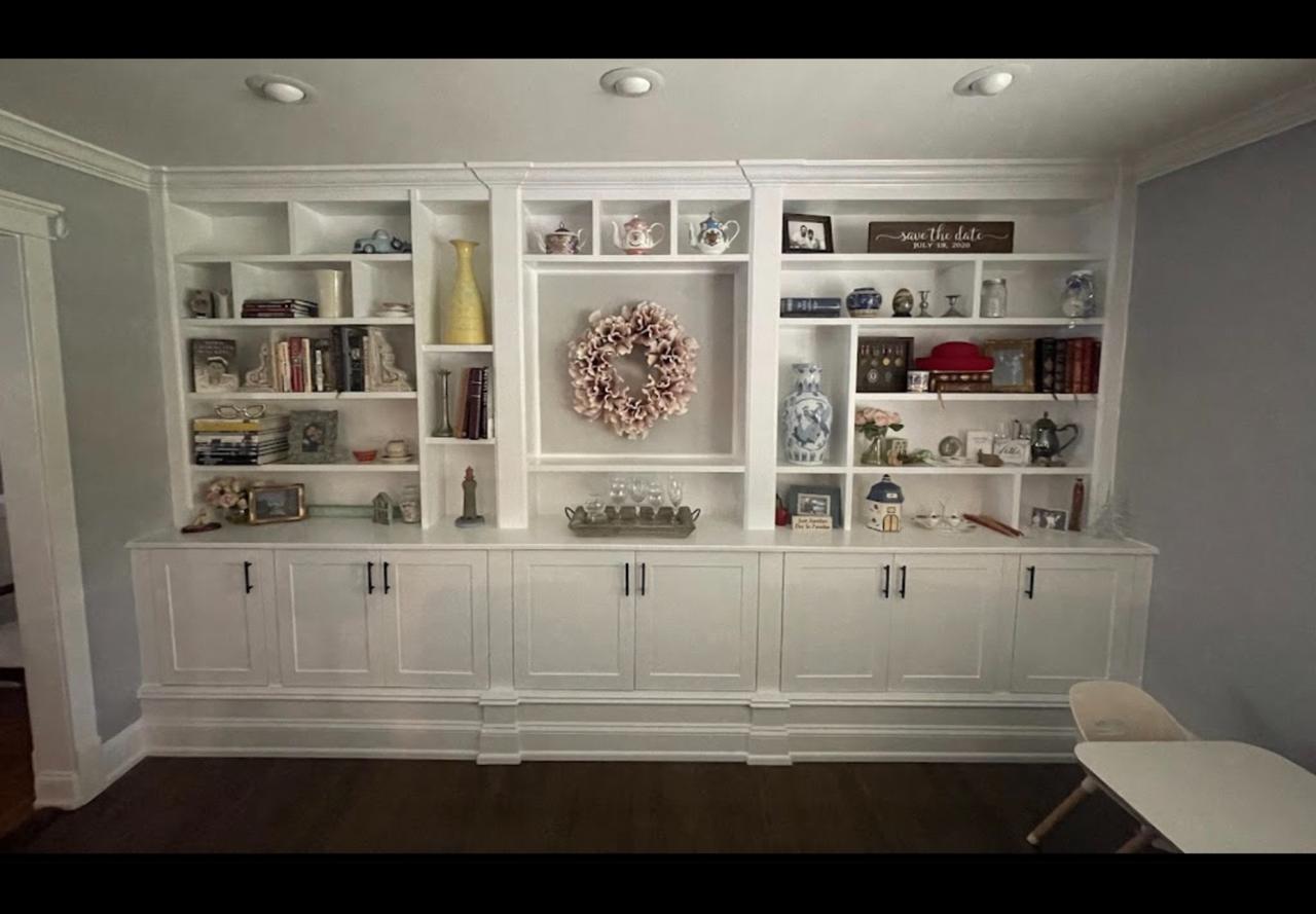 Full wall white built-in cabinetry unit