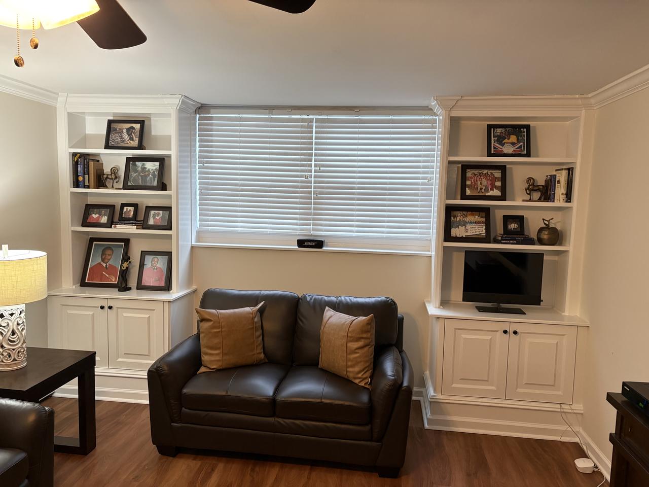 Built-in shelving and window seat in a living room