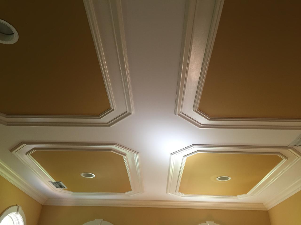 Gold-trimmed coffered ceiling with medallion