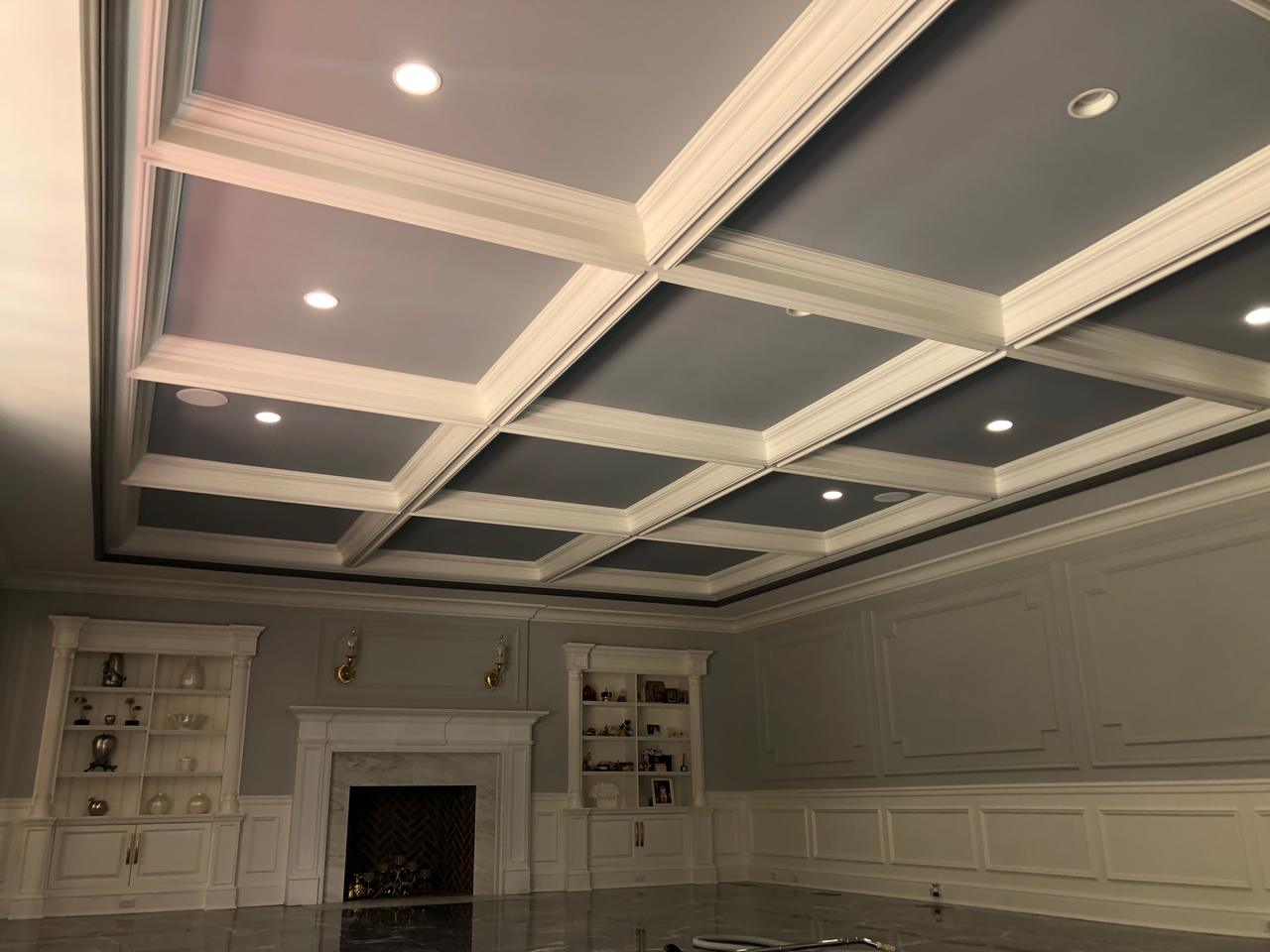 Navy coffered ceiling with built-in cabinetry