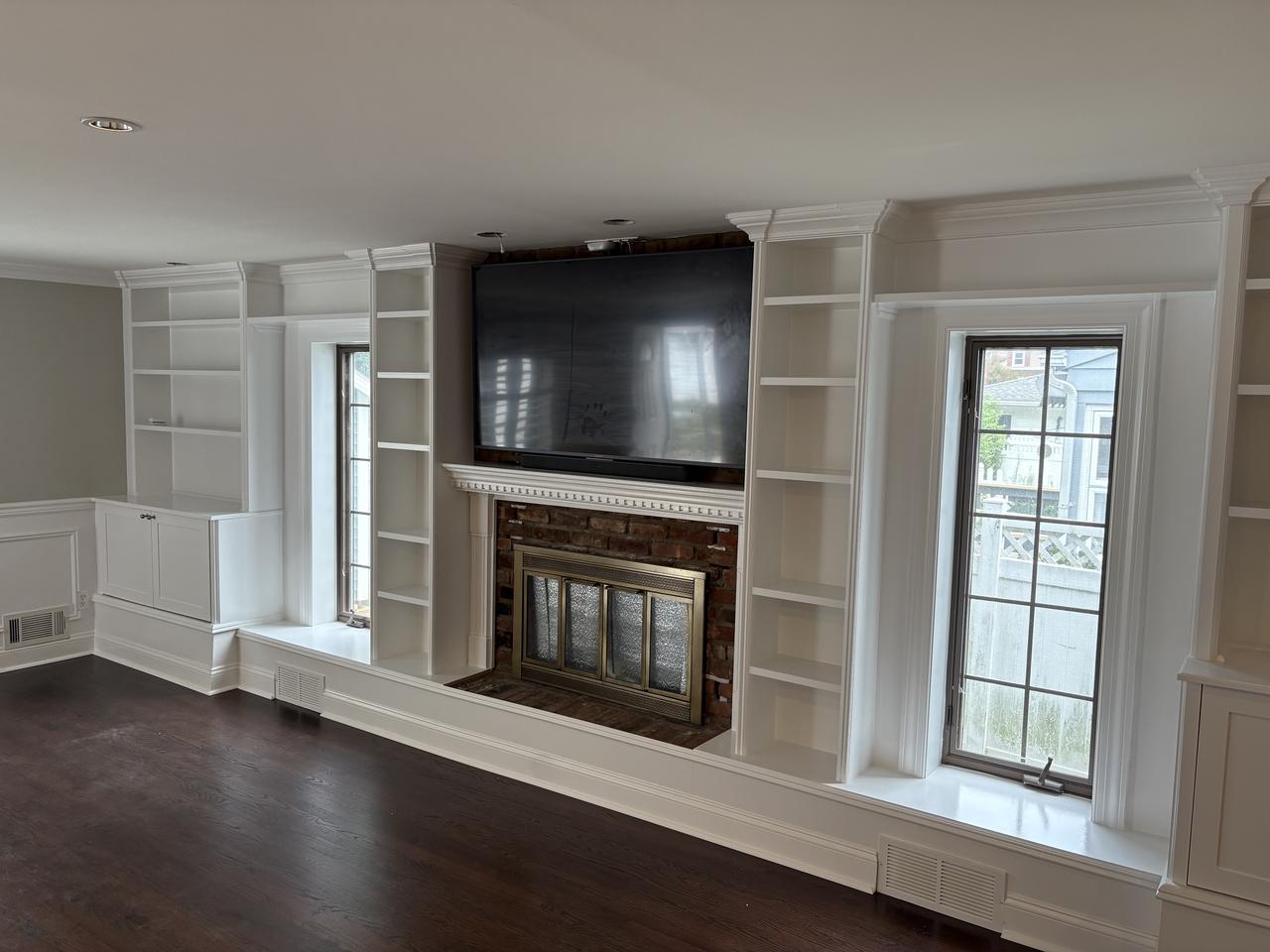 Fireplace mantel with flanking built-in cabinetry