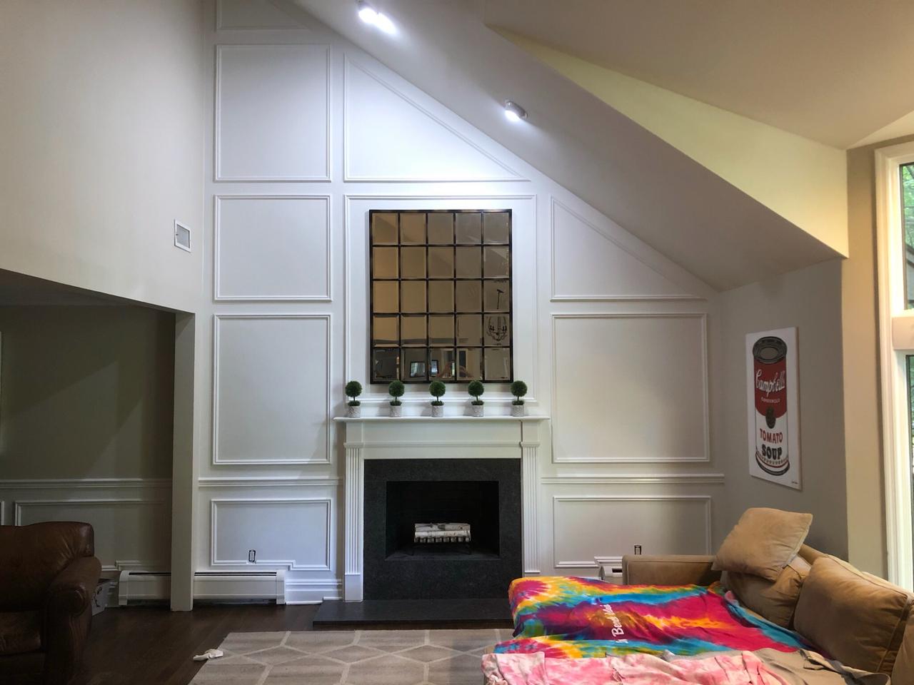 Fireplace niche under construction with trim surround
