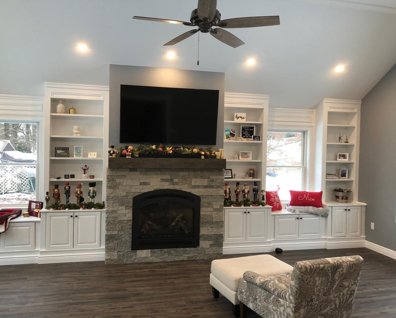 Fireplace with TV and flanking built-in cabinetry