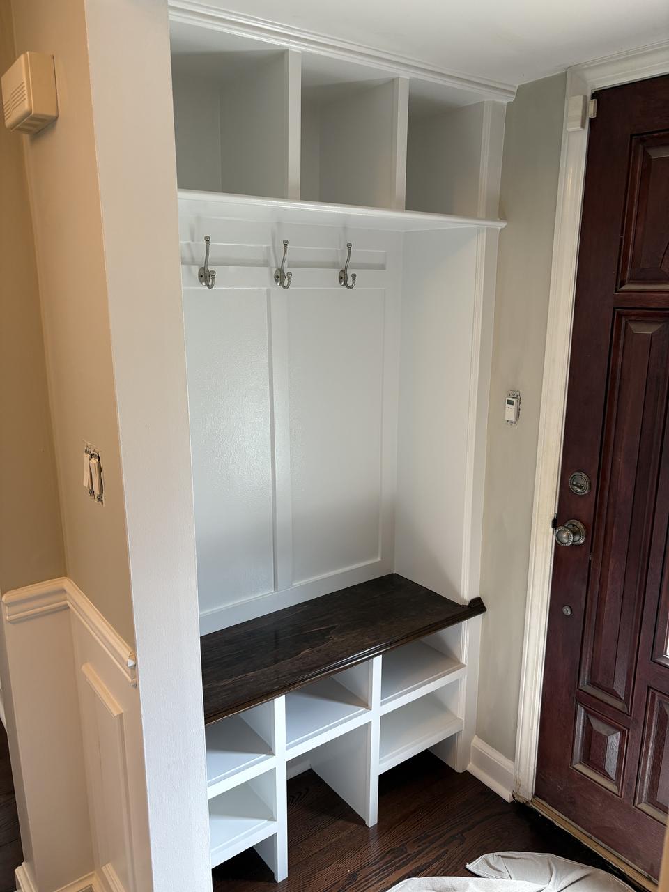 Mudroom bench with coat hooks and cubbies