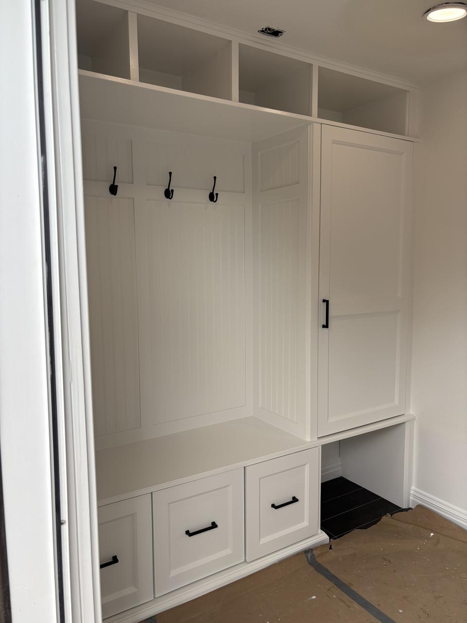 Mudroom built-in cubbies with hooks and benches