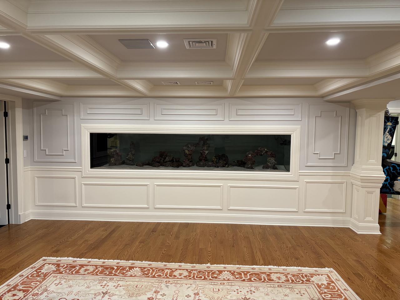 Entry hall with staircase and coffered detail
