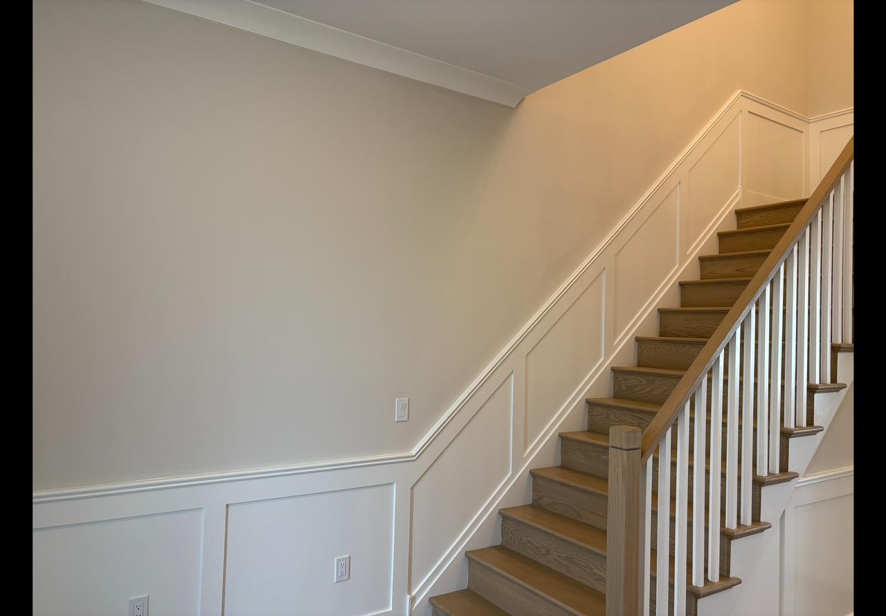 Staircase landing with wainscoting