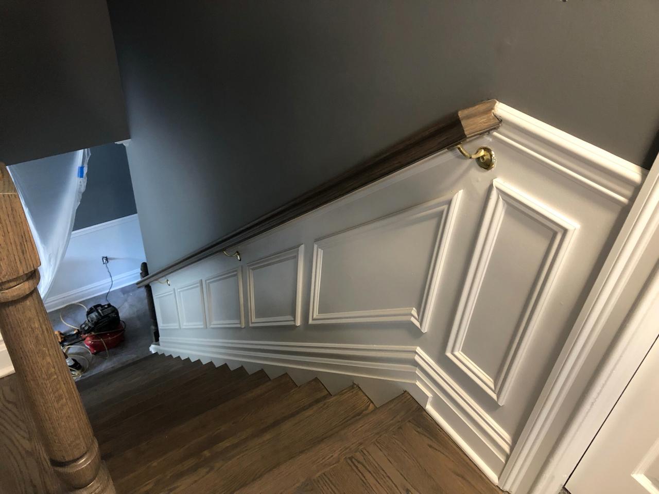 Front entry with sconces and wainscoting