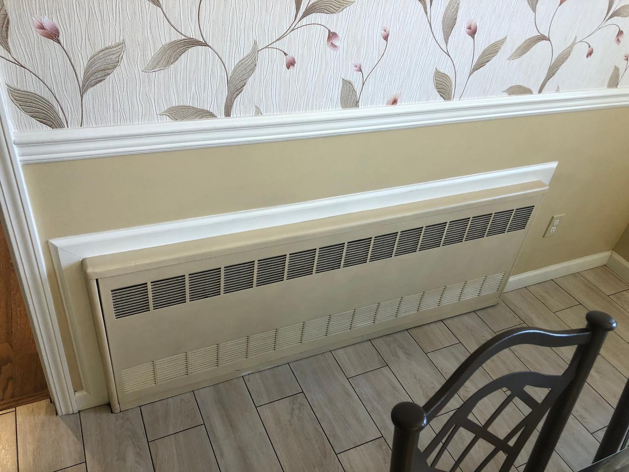 Two-tone wainscoting with chair rail and heat cover