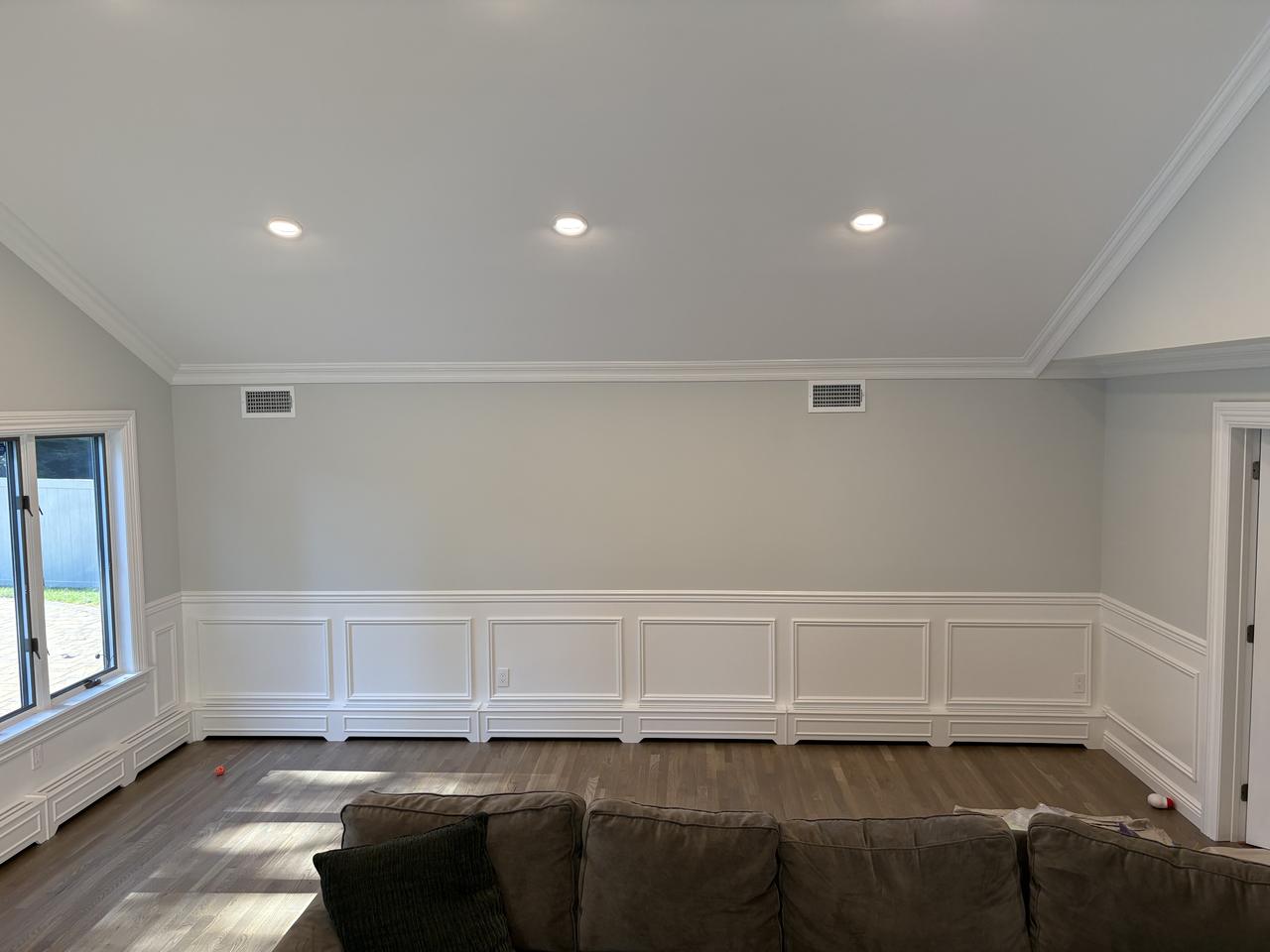 Wainscoting in a living room with wood floors