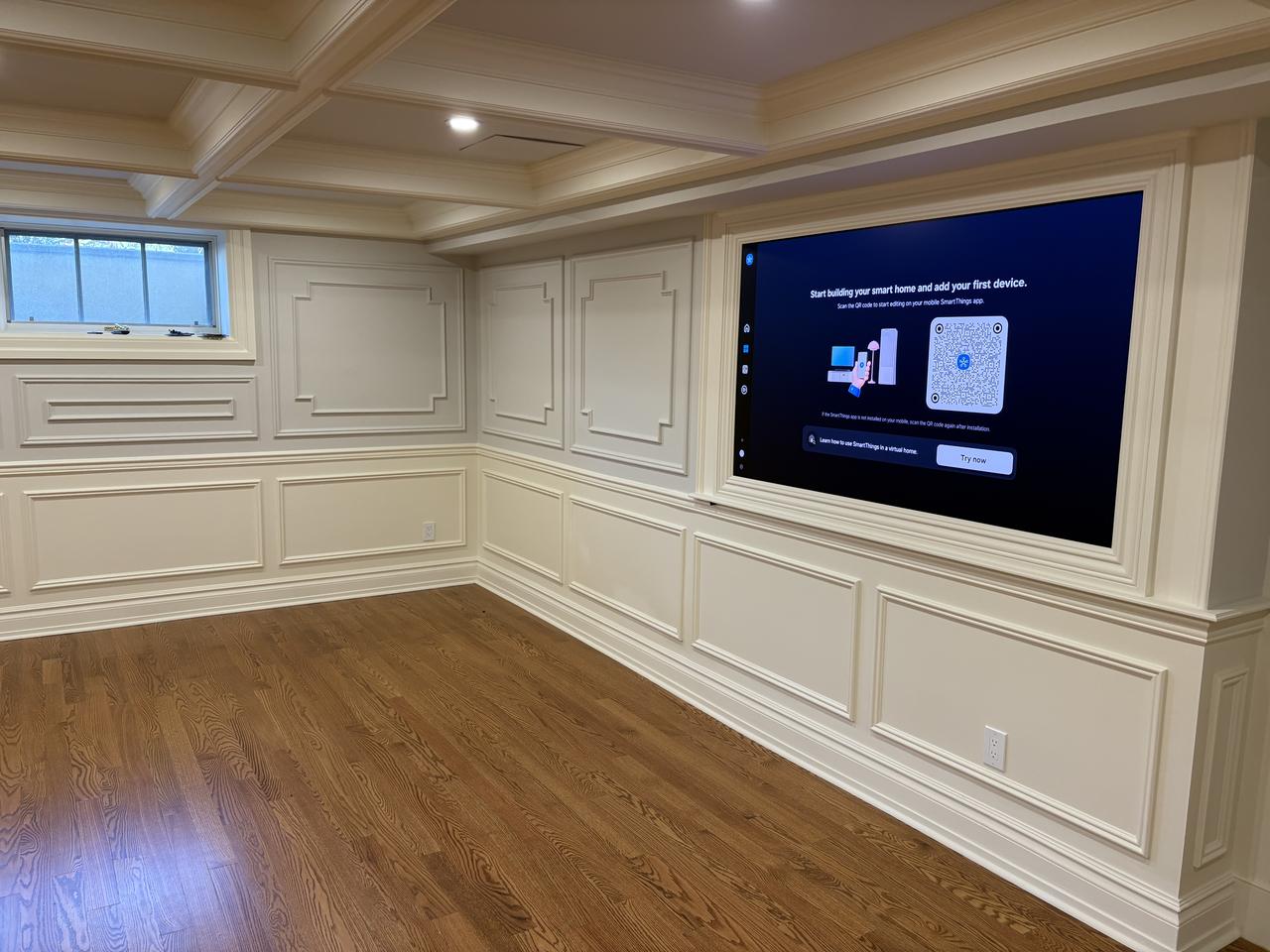 Wainscoting in a family room with built-in TV